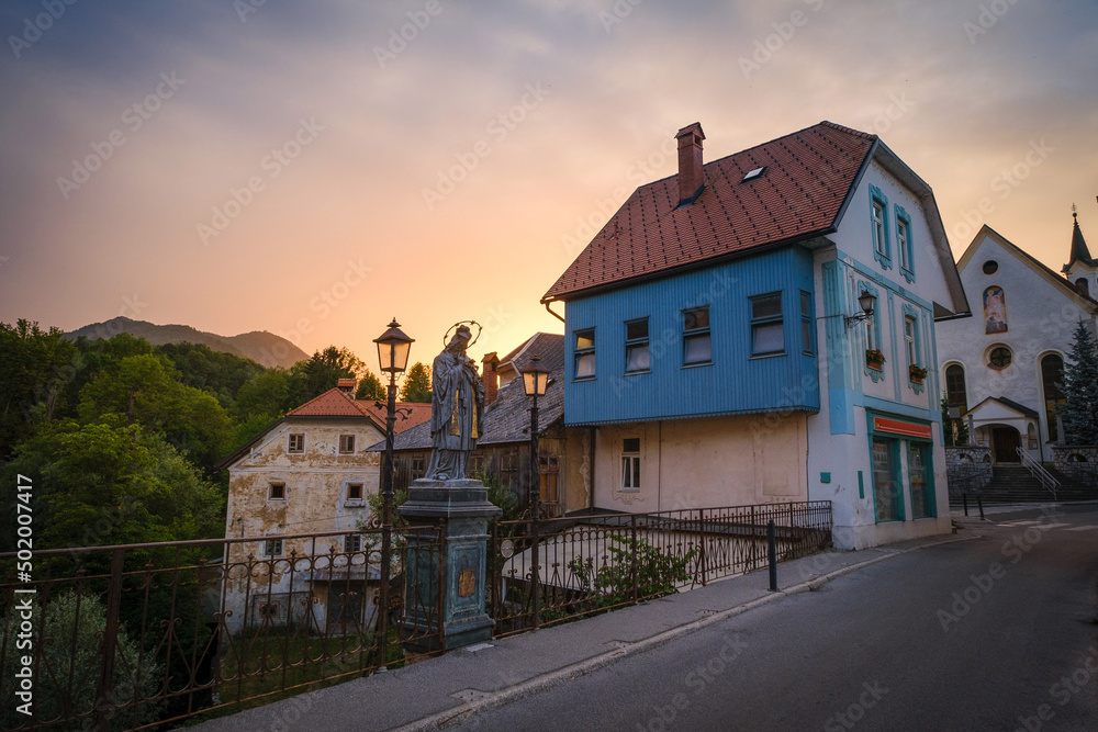 Skofja Loka sunset with Sora river and Stone bridge