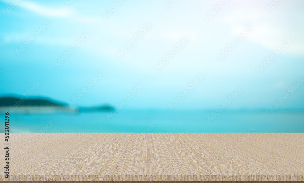 Fototapeta premium blurred natural blue sea gradient glow backdrop with retro brown wood texture panel color background for advertise,show,promote products on display