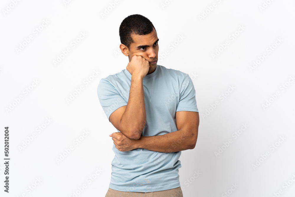 African American man over isolated white background with tired and bored expression African American man over isolated white background with tired and bored expression