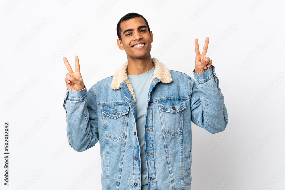 African American man over isolated white background showing victory sign with both hands African American man over isolated white background showing victory sign with both hands