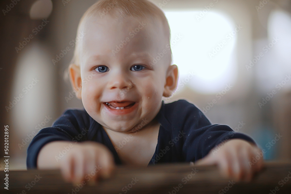 small child is laughing smiling a cheerful kid small child is laughing smiling a cheerful kid