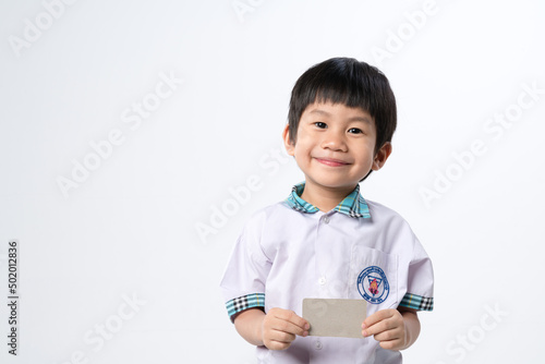 Asian boy holding paper credit card mockup for identification or bank