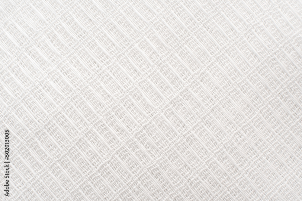 Light gray fabric background. Luxurious piece of white material for tailoring Light gray fabric background. Luxurious piece of white material for tailoring