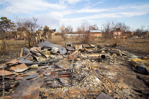 bombed houses in Ukraine during Russian aggression, burnt houses on the outskirts of the city