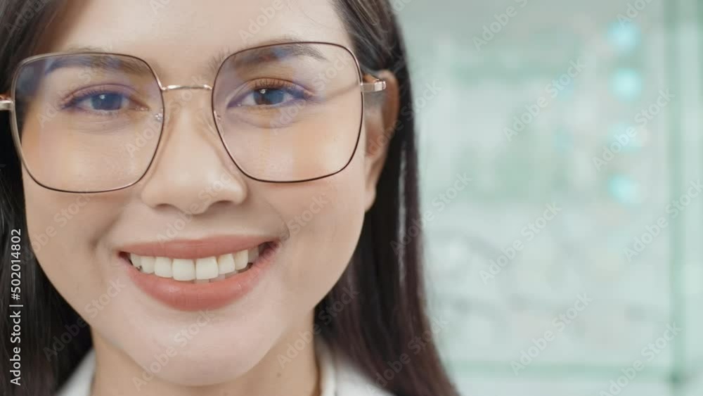 Portrait of ophthalmologist in optical center, eyecare concept. Portrait of ophthalmologist in optical center, eyecare concept.