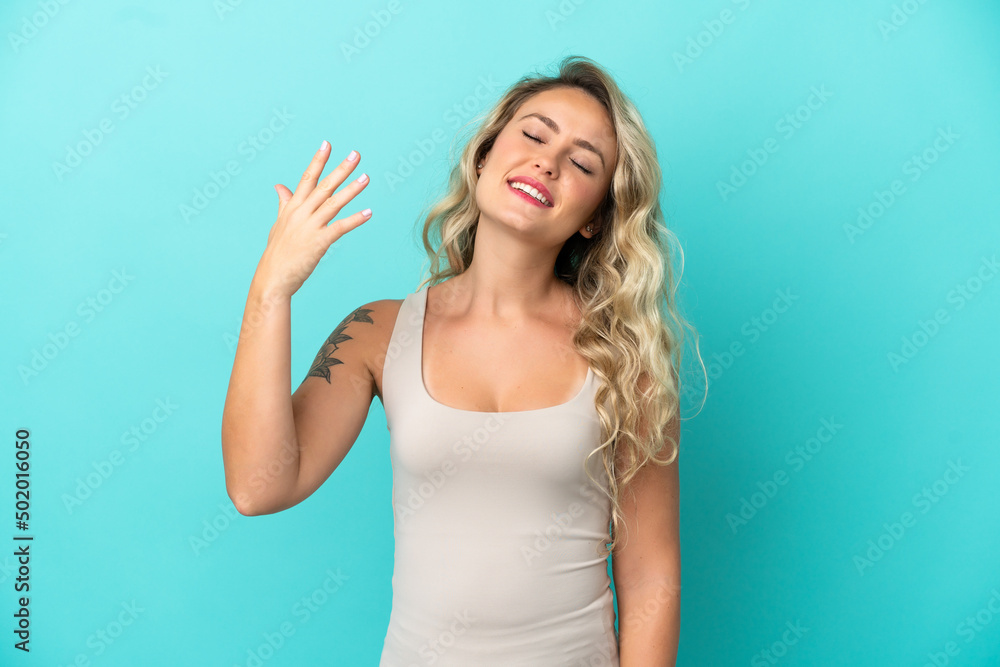 Young Brazilian woman isolated on blue background with tired and sick expression Young Brazilian woman isolated on blue background with tired and sick expression