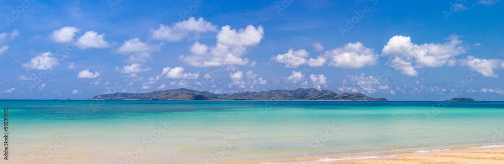Panorama view of tropical virgin island in clear blue sky summer with turquoise sea water and white sand beach for dream vacation of paradise travel destination and getaway peaceful trip in Thailand