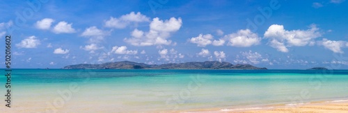 Fototapeta Naklejka Na Ścianę i Meble -  Panorama view of tropical virgin island in clear blue sky summer with turquoise sea water and white sand beach for dream vacation of paradise travel destination and getaway peaceful trip in Thailand