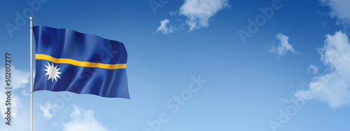 Nauru flag isolated on a blue sky. Horizontal banner