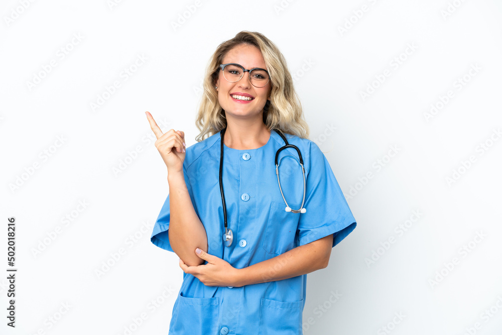 Brazilian surgeon doctor woman over isolated background pointing up a great idea