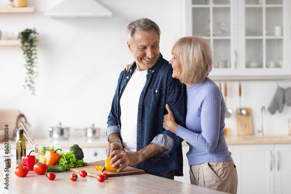 Loving husband making dinner for his beautiful wife Loving husband making dinner for his beautiful wife