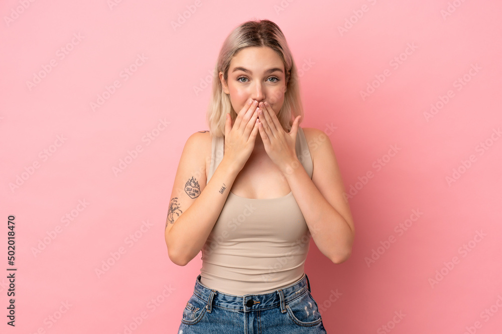 Young caucasian woman isolated on pink background happy and smiling covering mouth with hands Young caucasian woman isolated on pink background happy and smiling covering mouth with hands