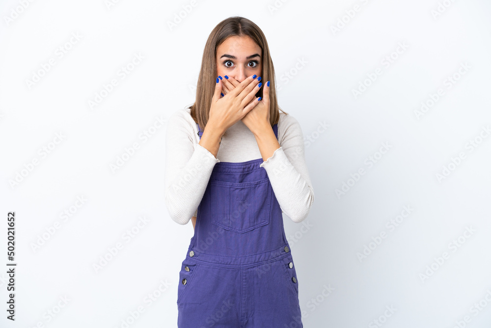 Young caucasian woman isolated on white background covering mouth with hands Young caucasian woman isolated on white background covering mouth with hands