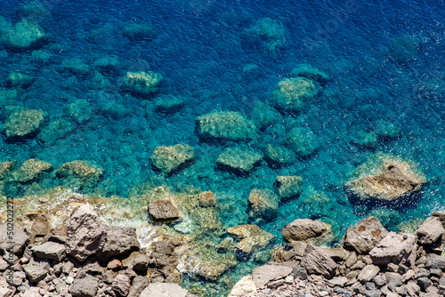 Stones at the bottom of the blue ocean.