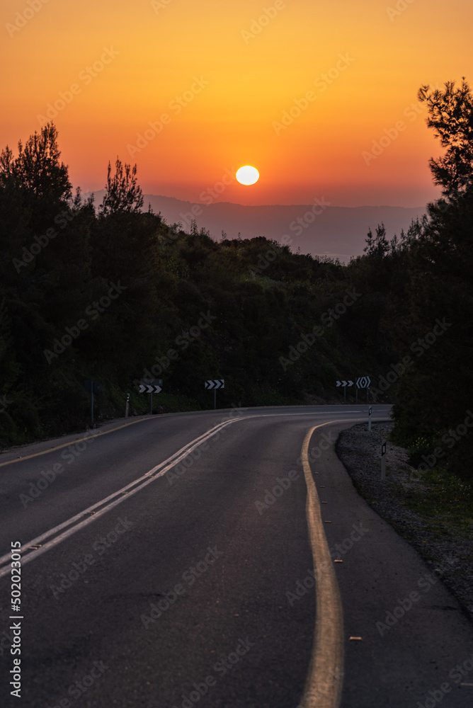 Road on Mount Gilboa as the sun goes down on a peaceful evening in Israel
