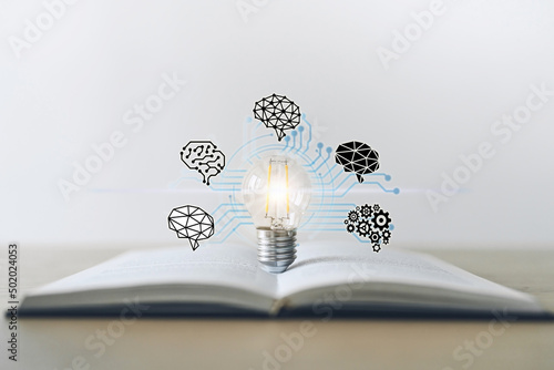 Light bulb with textbook. Success idea business learning and knowledge