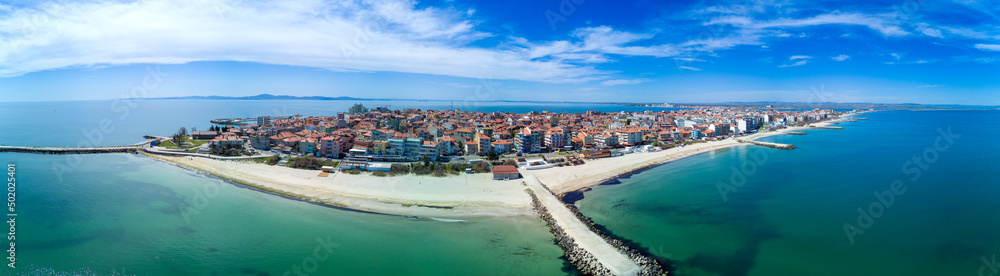 Panoramic view from a height above the town of Pomorie with houses and streets washed by the Black Sea in Bulgaria