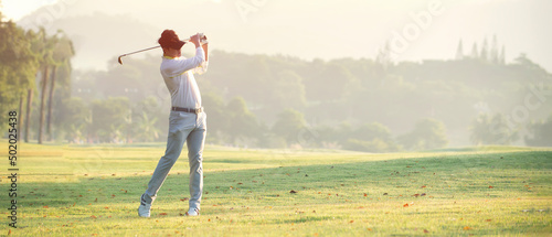 Asian  professional golfer with golf club playing  golf