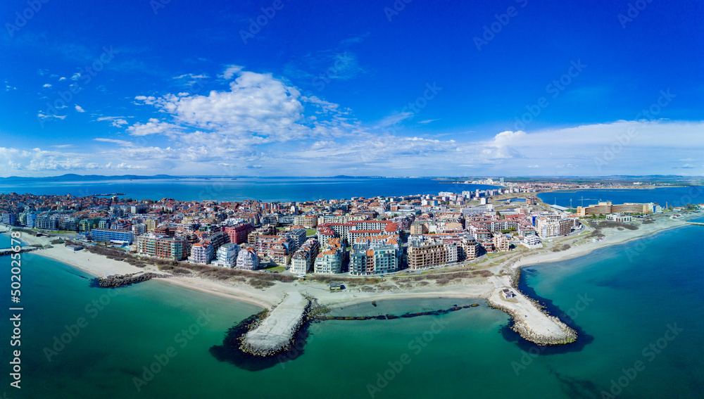 Panoramic view from a height above the town of Pomorie with houses and streets washed by the Black Sea in Bulgaria