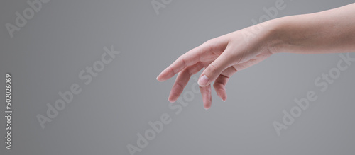 Photos Female hand reaching for something