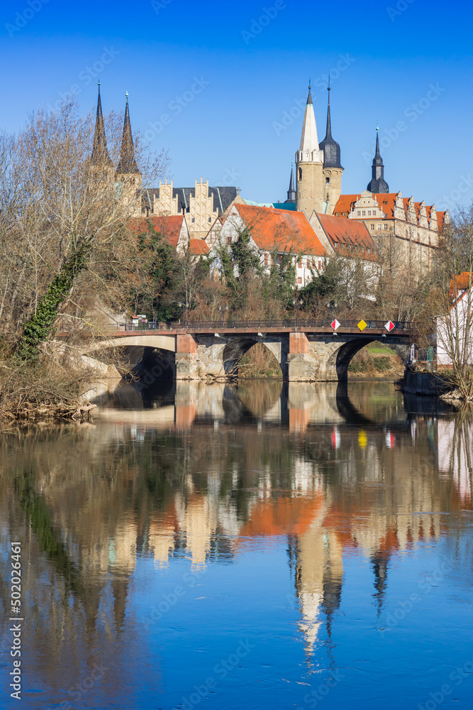 Historic castle and bridge reflecting in the river Saale in Merseburg, Germany