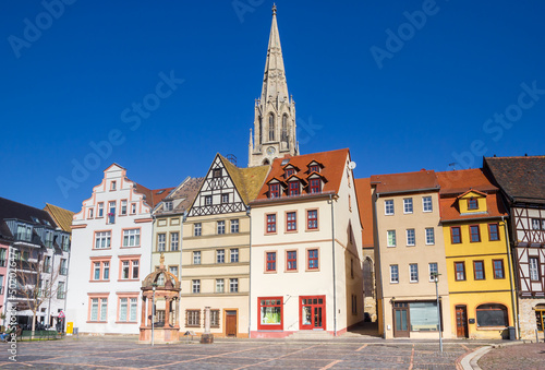 Historic market square with colorful houses and church tower in Merseburg, Germany