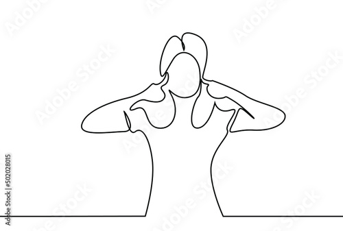 beautiful woman plugs her ears with her fingers and doesn't want to hear