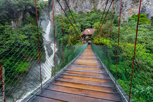 Suspended bridge in El Pailon del Diablo waterfall in Banos Santa Agua, Ecuador. South America.