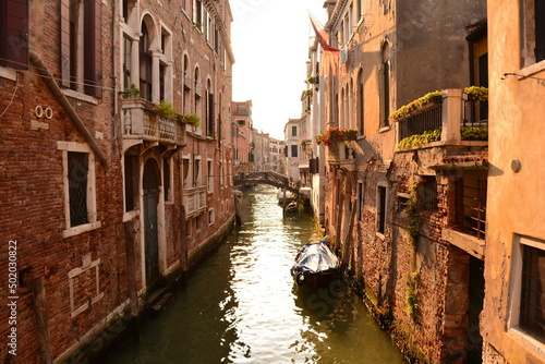 canal in venice with small boat