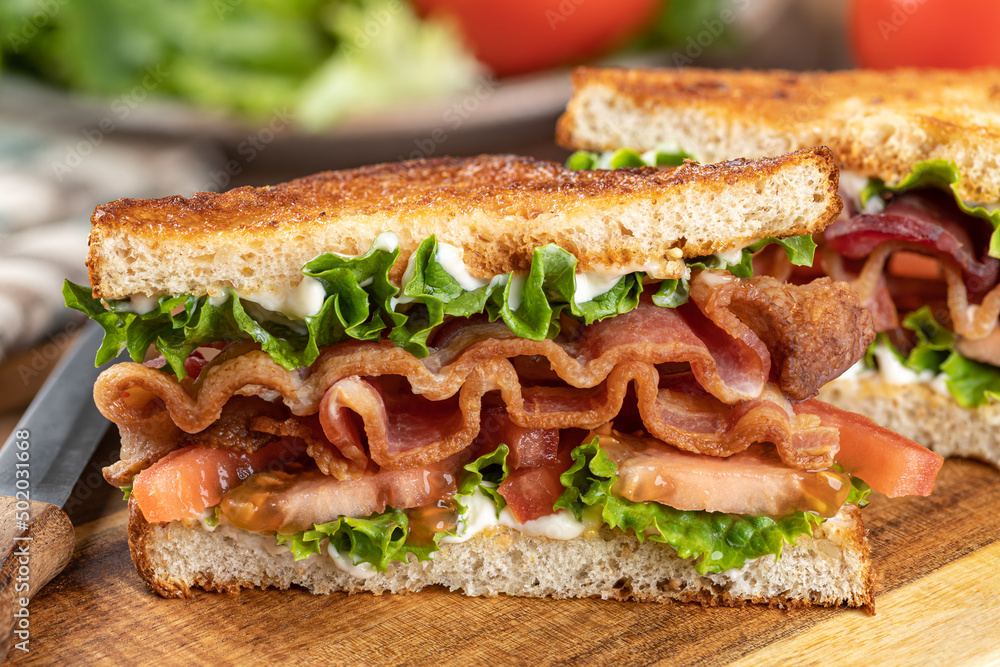 Bacon, lettuce and tomato sandwich cut in half Bacon, lettuce and tomato sandwich cut in half