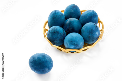 Blue painted eggs on a white background