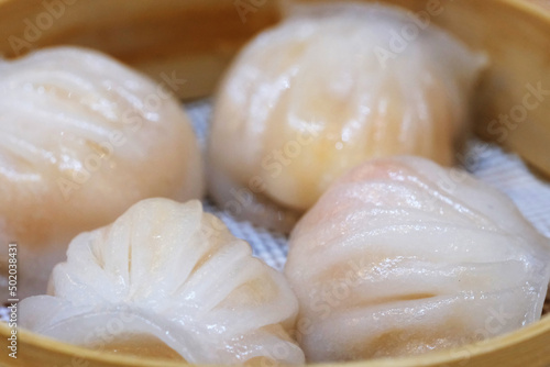 extreme close up of several Har gow (Xia jiao) in steamer. A traditional Cantonese snack served in dim sum