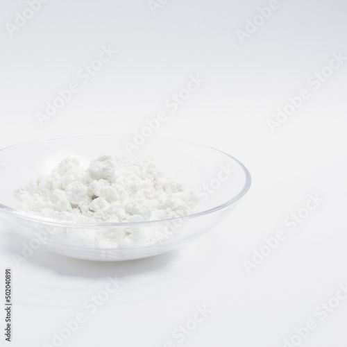 cottage cheese in a glass transparent bowl isolated on a white background