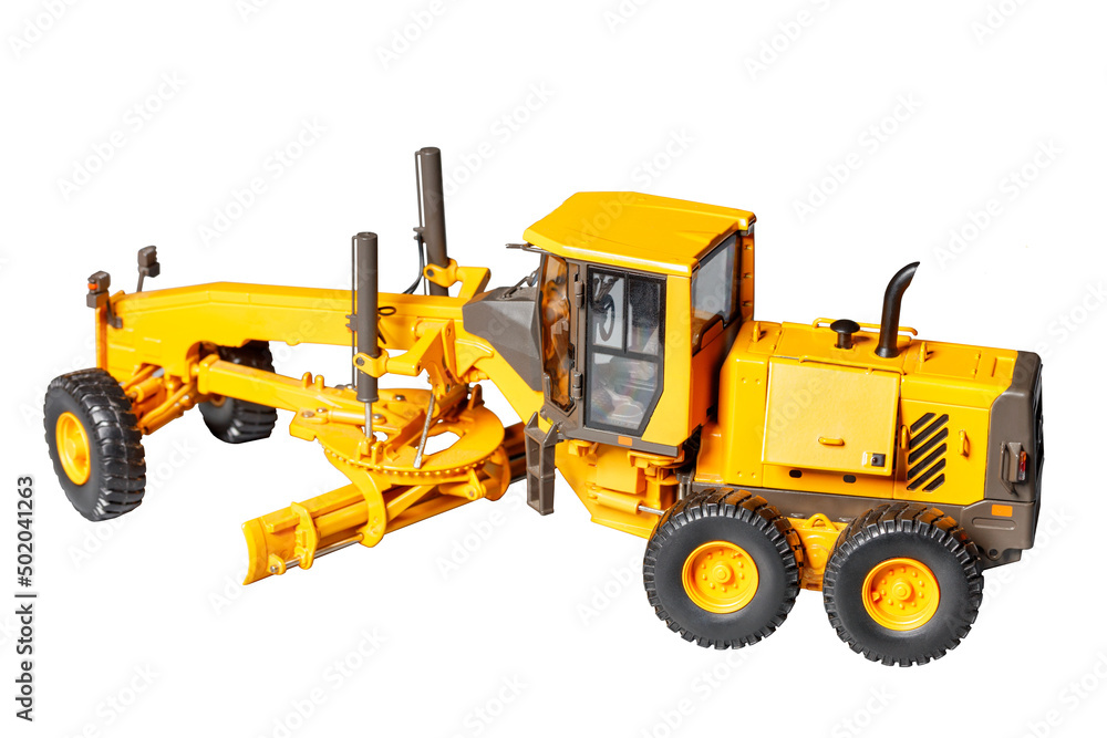 A toy model of a powerful construction road tractor with an adjustable blade on a white background. A toy model of a powerful construction road tractor with an adjustable blade on a white background.