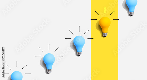 One out unique idea light bulb concept - Flat lay