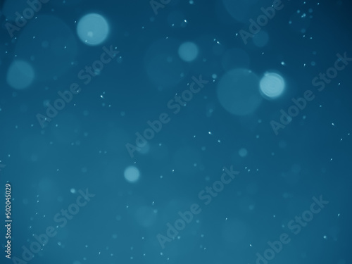 blue background with particles circle bubble and gardient. blue bokeh big and small blurred. abtractbackground bokeh circle. photo