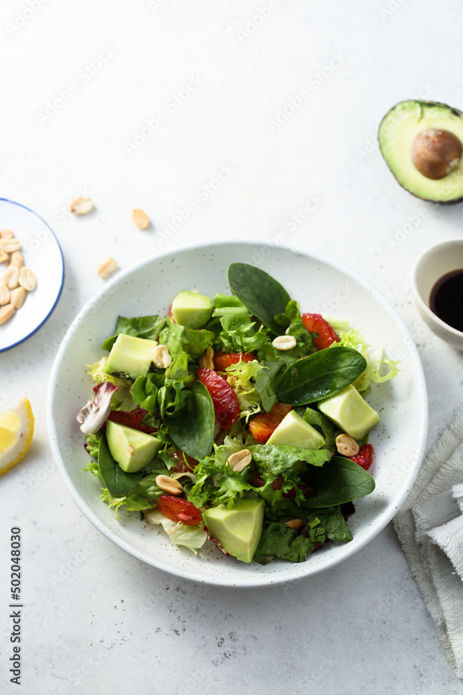 Healthy green salad with avocado and bloody orange Healthy green salad with avocado and bloody orange