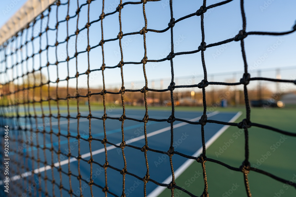 late afternoon close up of tennis court net. late afternoon close up of tennis court net.