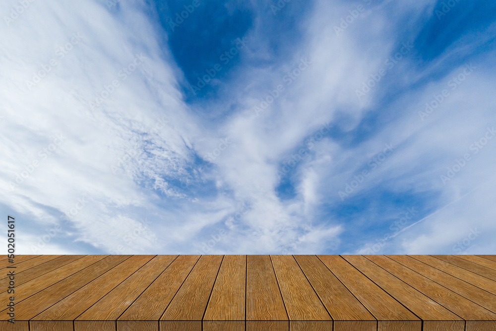 white cloud and blue sky background image with wood floor