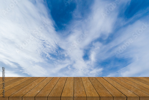 white cloud and blue sky background image with wood floor