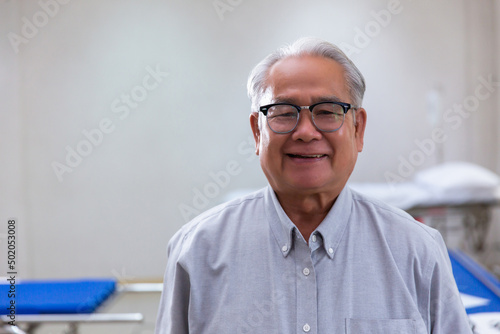 Portrait Asian senior man , old man , feel happy good health on hospital background - lifestyle senior male concept,copy space for text.