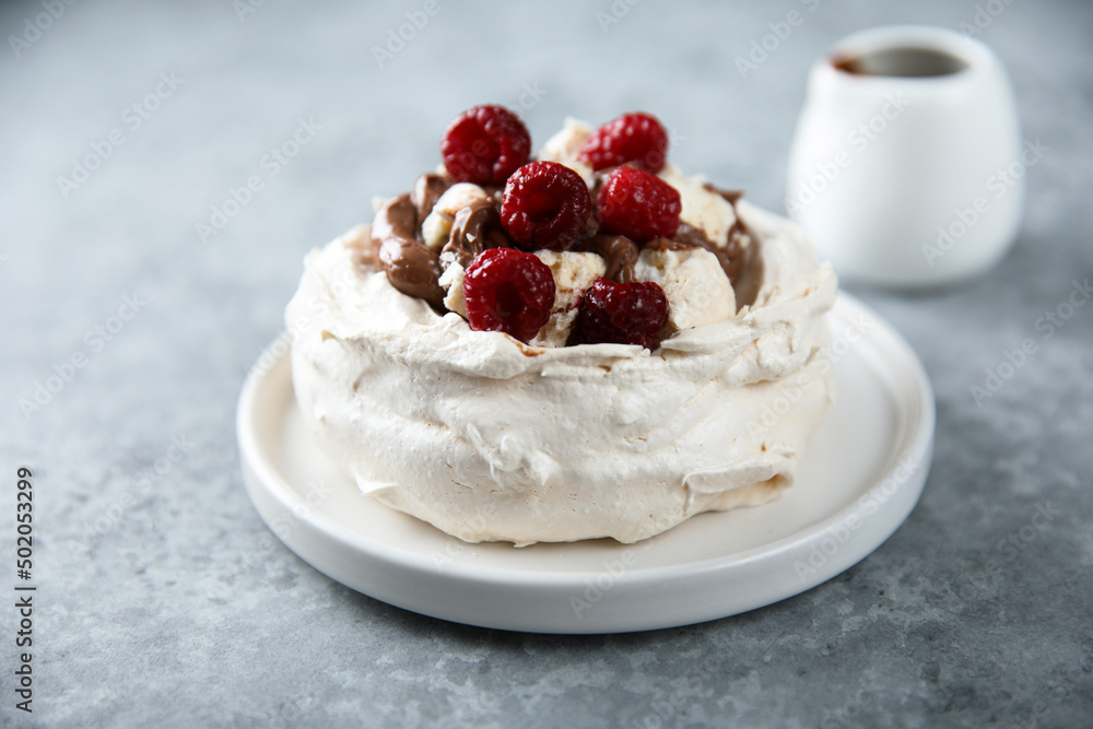 Homemade Pavlova dessert with raspberry and chocolate Homemade Pavlova dessert with raspberry and chocolate