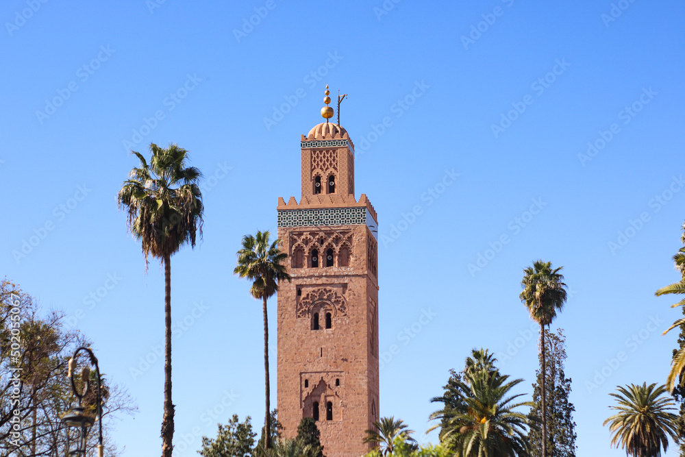 Minaret of Koutoubia mosque on blue sky background in Marrakech, Morocco