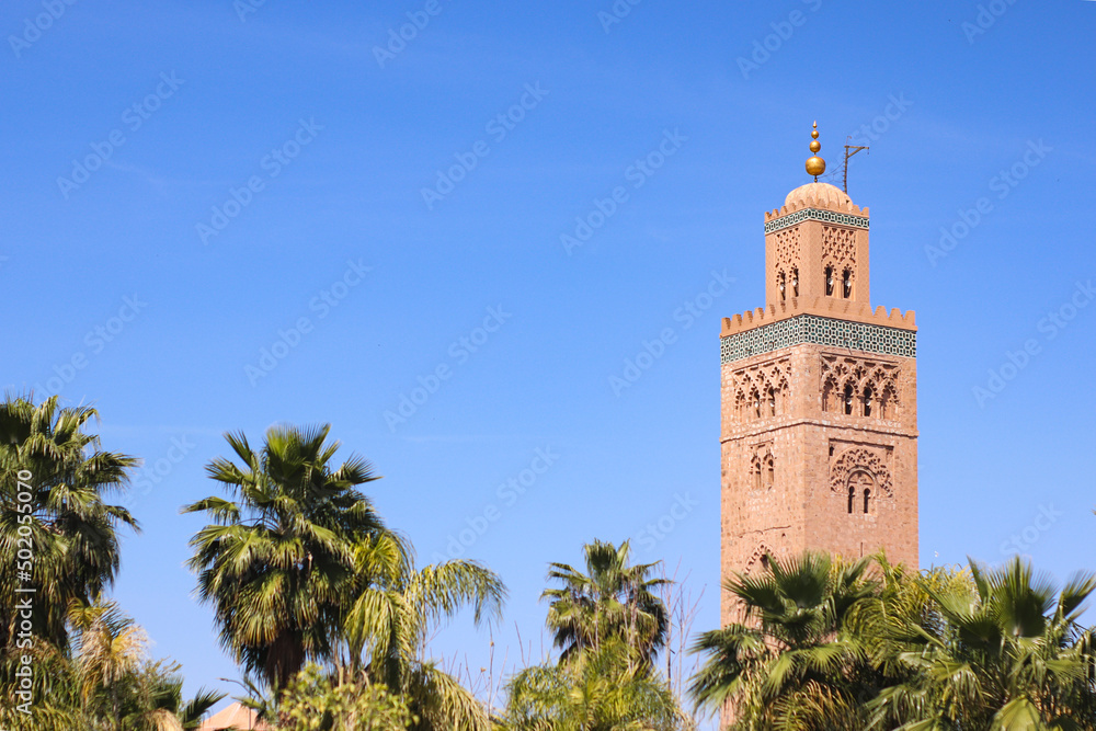 Fototapeta premium Minaret of Koutoubia mosque on blue sky background in Marrakech, Morocco