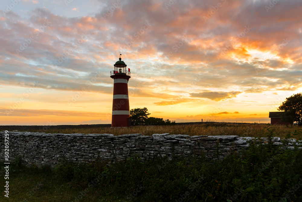 The Lighthouse of the peninsula Naersholmen at the coast of Gotland in the evening