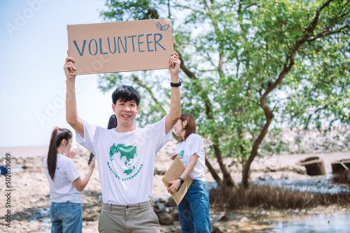 Group of Asian diverse people volunteer holding a speech sign for World Environment Day campaign,Earth Day about pollution,ecosystem,energy and gabage.