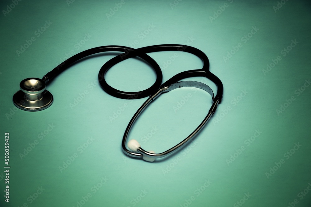 A stethoscope on a light green gradient background, Medical background concept A stethoscope on a light green gradient background, Medical background concept