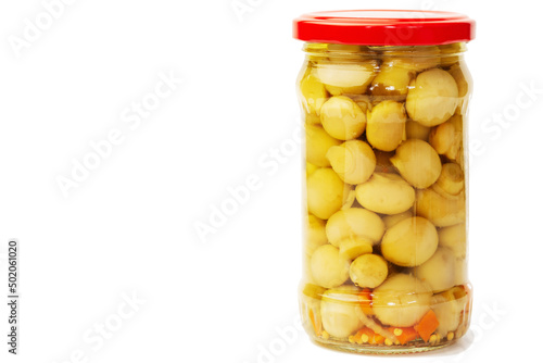 Canned champignons in a glass jar, ready to eat