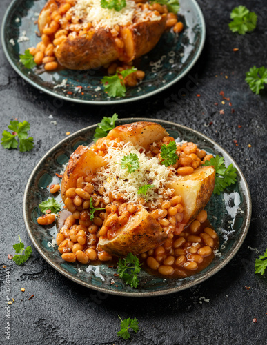 Jacket Baked potato with tomato beans, cheddar cheese. Traditional British food