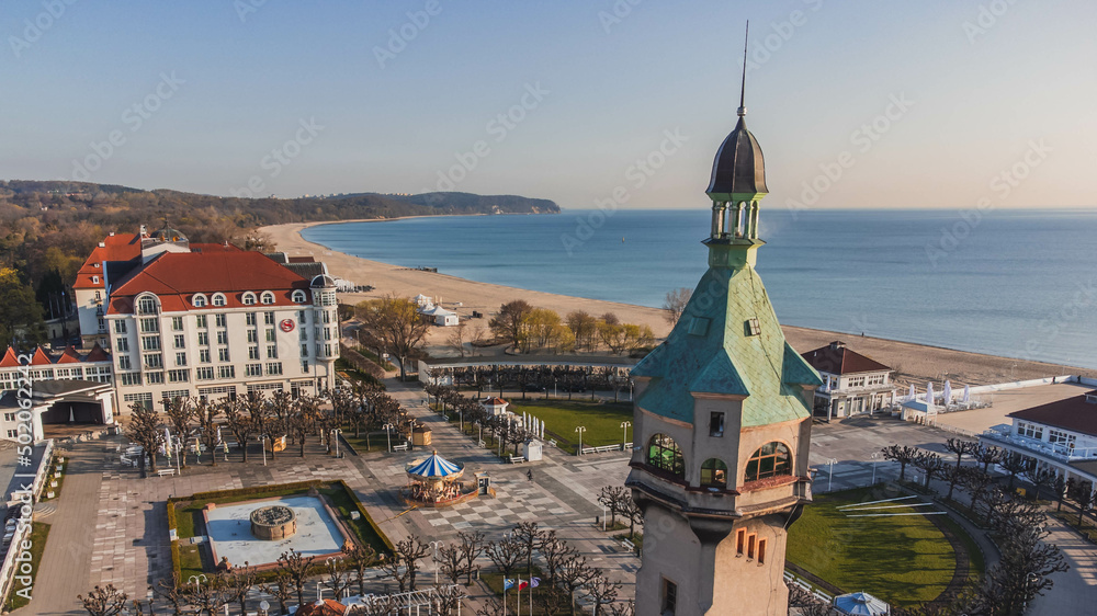 Naklejka premium Morning view of the pier in Sopot, lighthouses and the Baltic Sea. View from the drone.